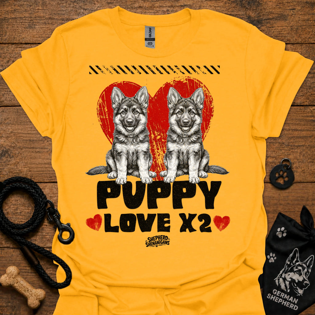 Gold kids dog T-shirt with two gray puppies, red hearts, and 'PUPPY LOVE X2' print.