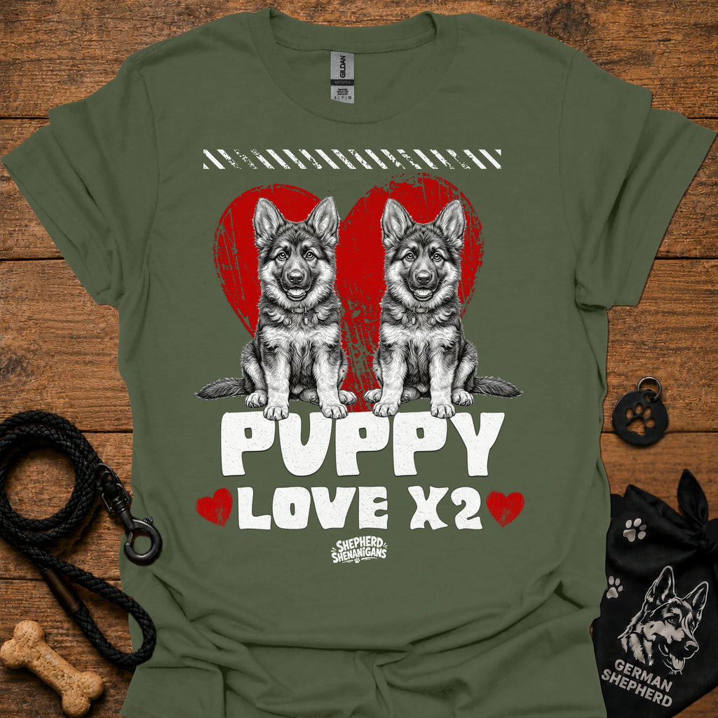 Military green kids dog T-shirt with two gray puppies, red hearts, and 'PUPPY LOVE X2' print.