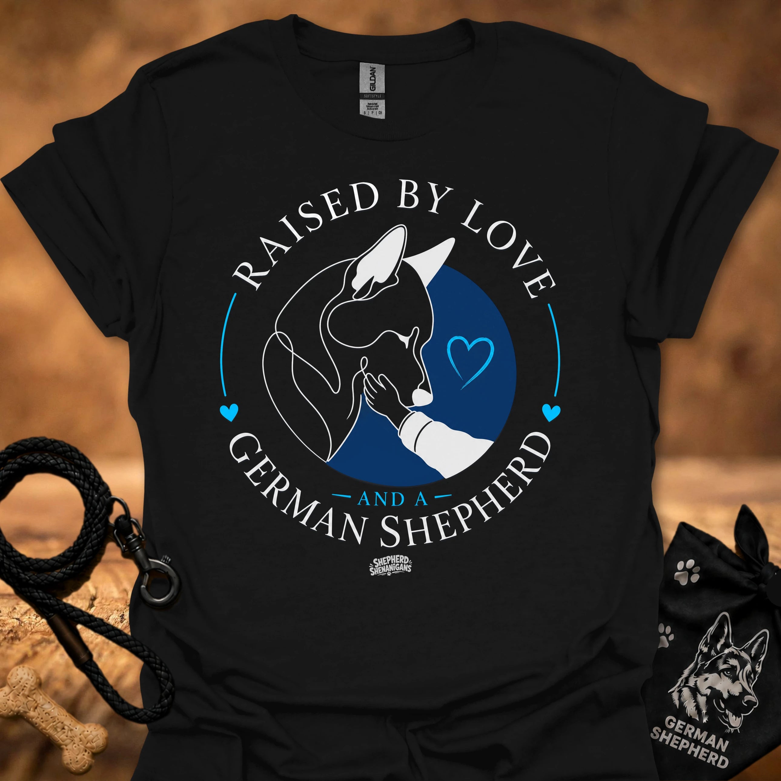 Black T-shirt with Raised By Love German Shepherd graphic and blue heart circle