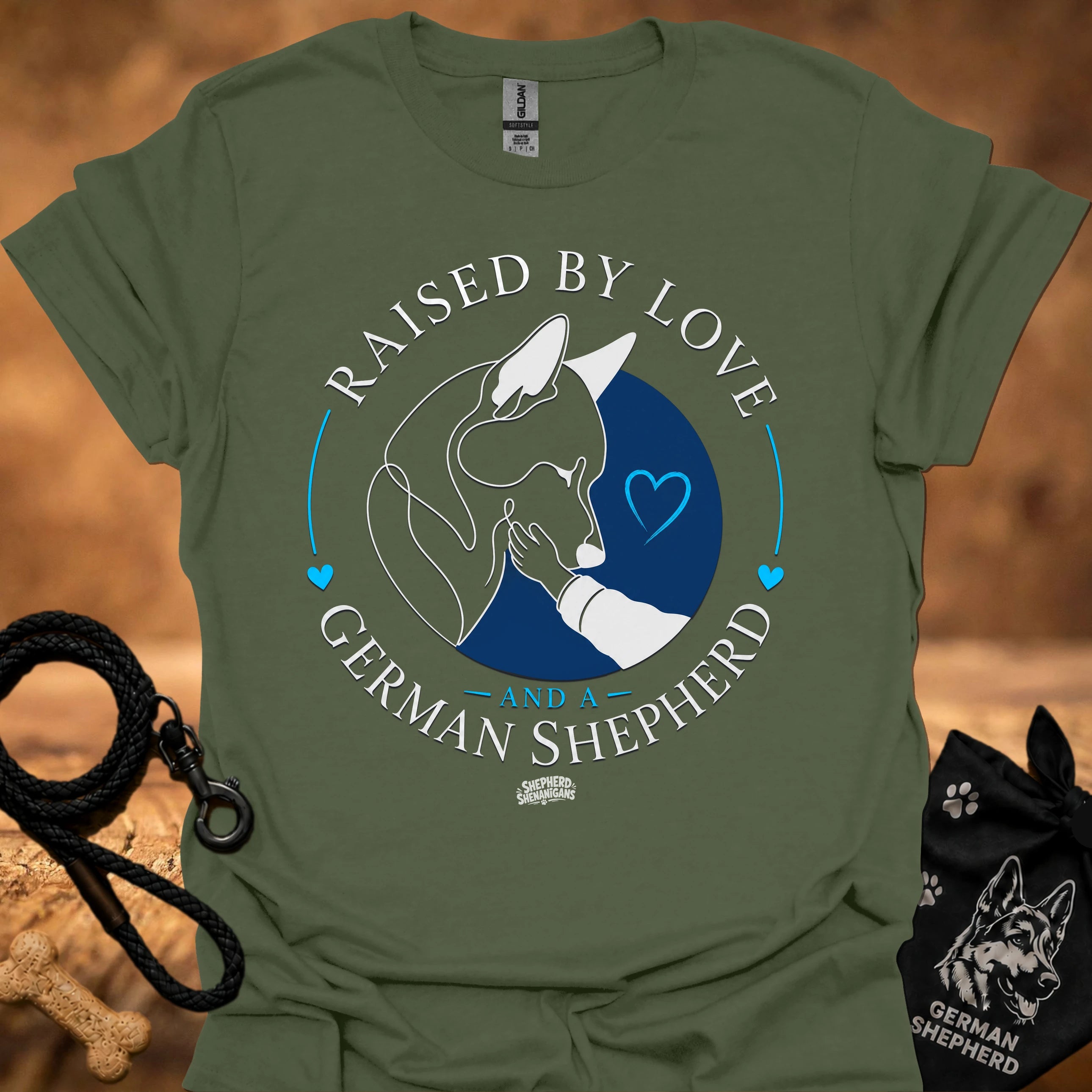 Military green T-shirt with Raised By Love German Shepherd graphic and blue heart circle