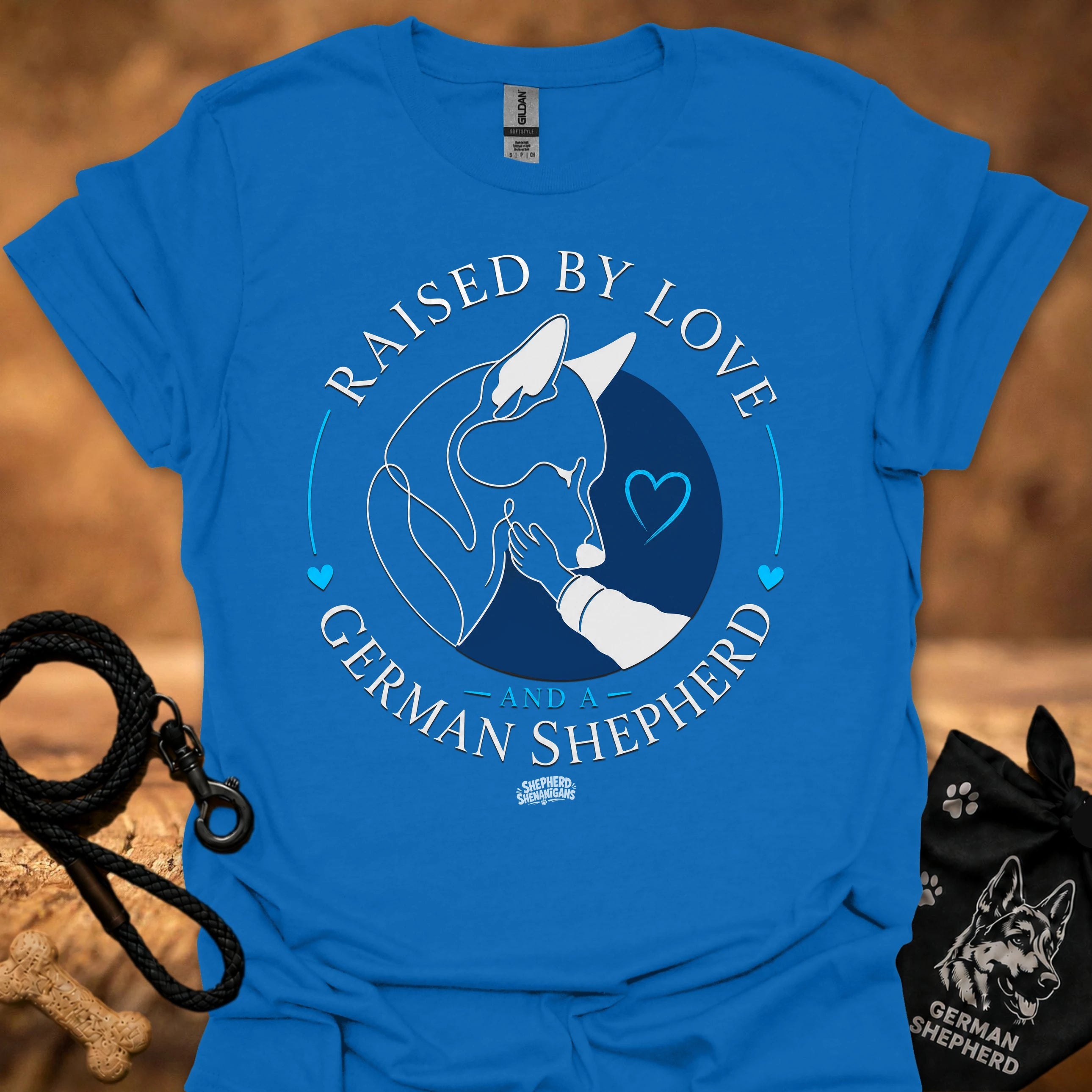 Royal blue T-shirt with Raised By Love German Shepherd graphic and blue heart circle