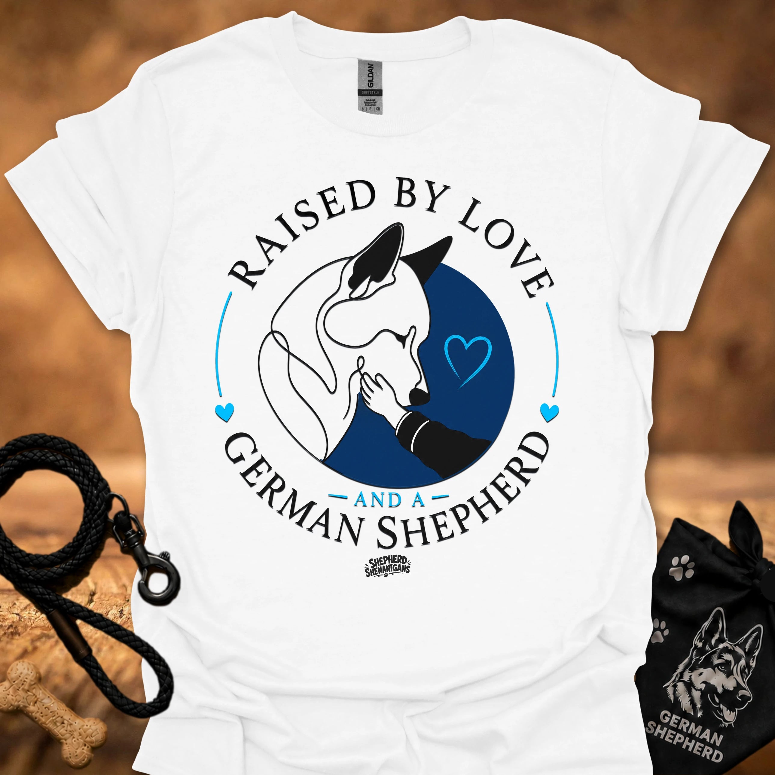 White T-shirt with Raised By Love German Shepherd graphic and blue heart circle
