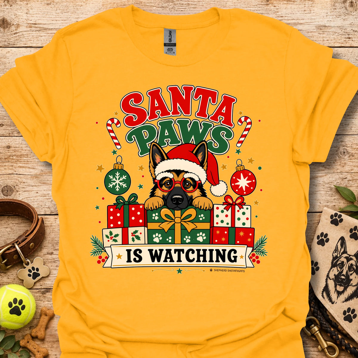 Gold crew-neck t-shirt with cartoon dog Santa hat and gift graphic