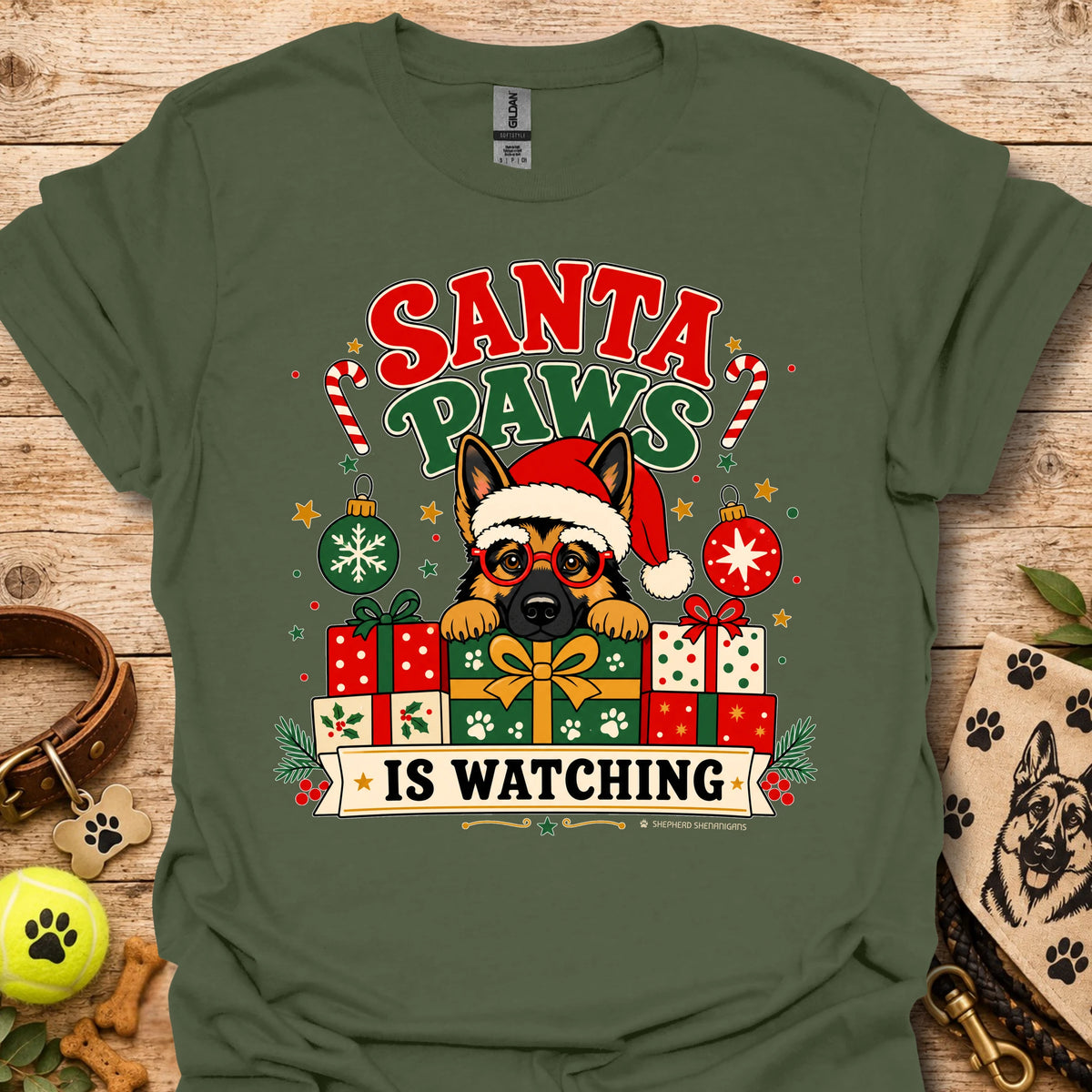 Military green crew-neck t-shirt with cartoon dog Santa hat and gift graphic