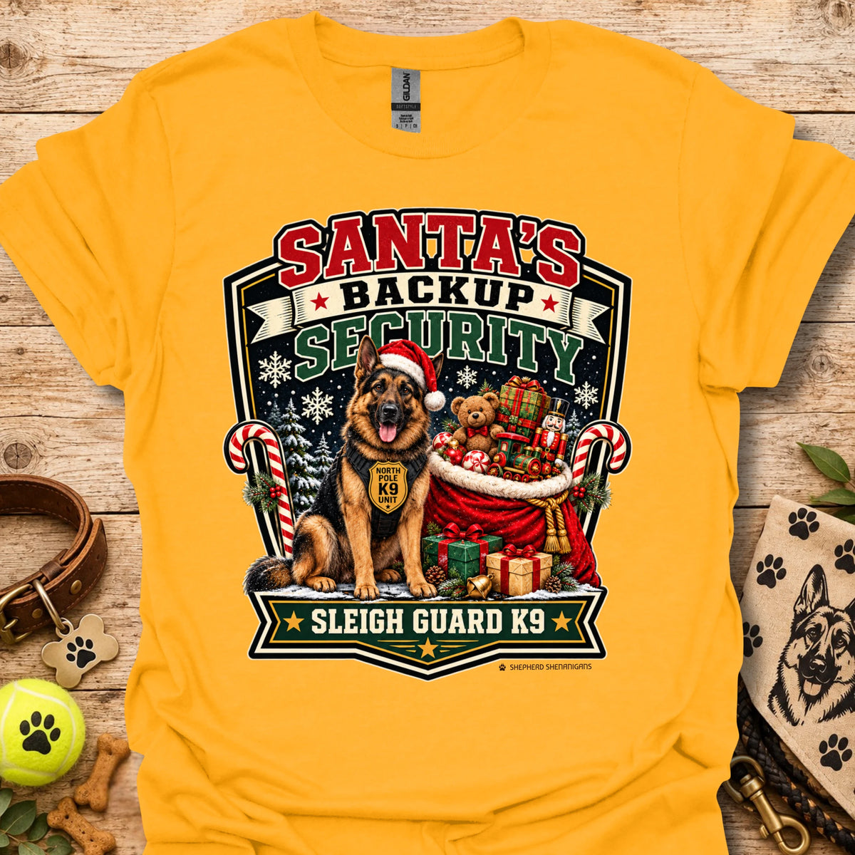 Gold T-shirt with Santa security K9 sleigh guard graphic