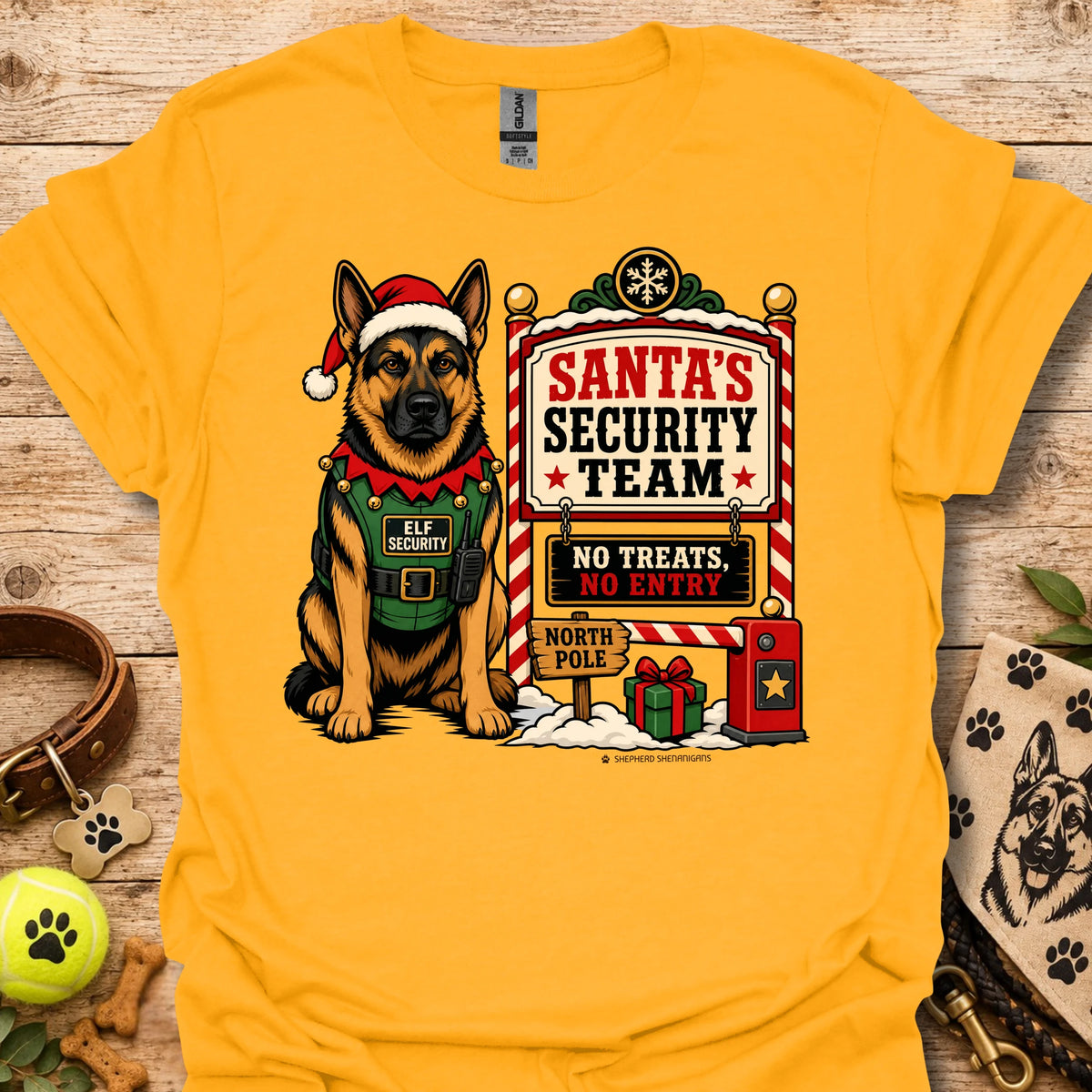Gold T-shirt with elf-dog illustration next to Santa's Security Team poster graphic