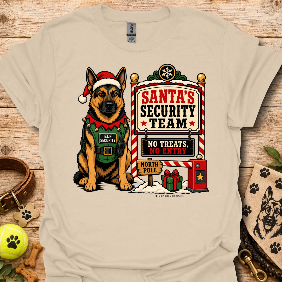 Sand T-shirt with elf-dog illustration beside Santa's Security Team poster print