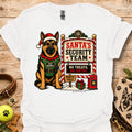 White T-shirt with elf dog illustration beside Santa's Security Team poster graphic