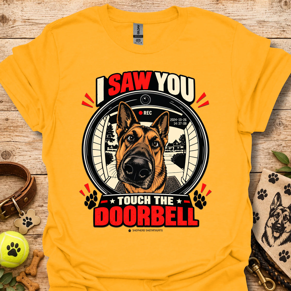 Gold dog doorbell graphic T-shirt with circular “Touch the Doorbell” lettering