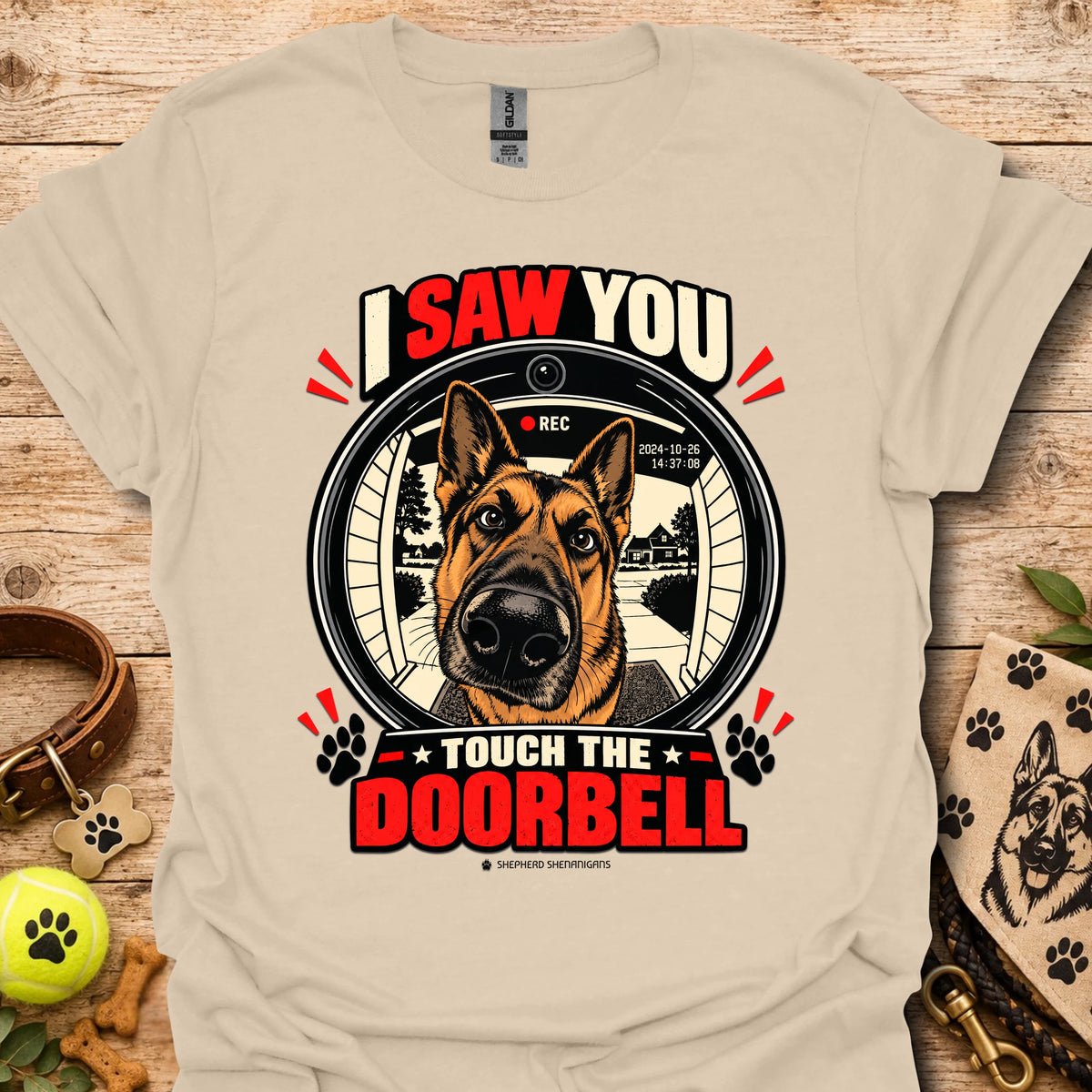 Sand dog doorbell graphic T-shirt with circular “Touch the Doorbell” print