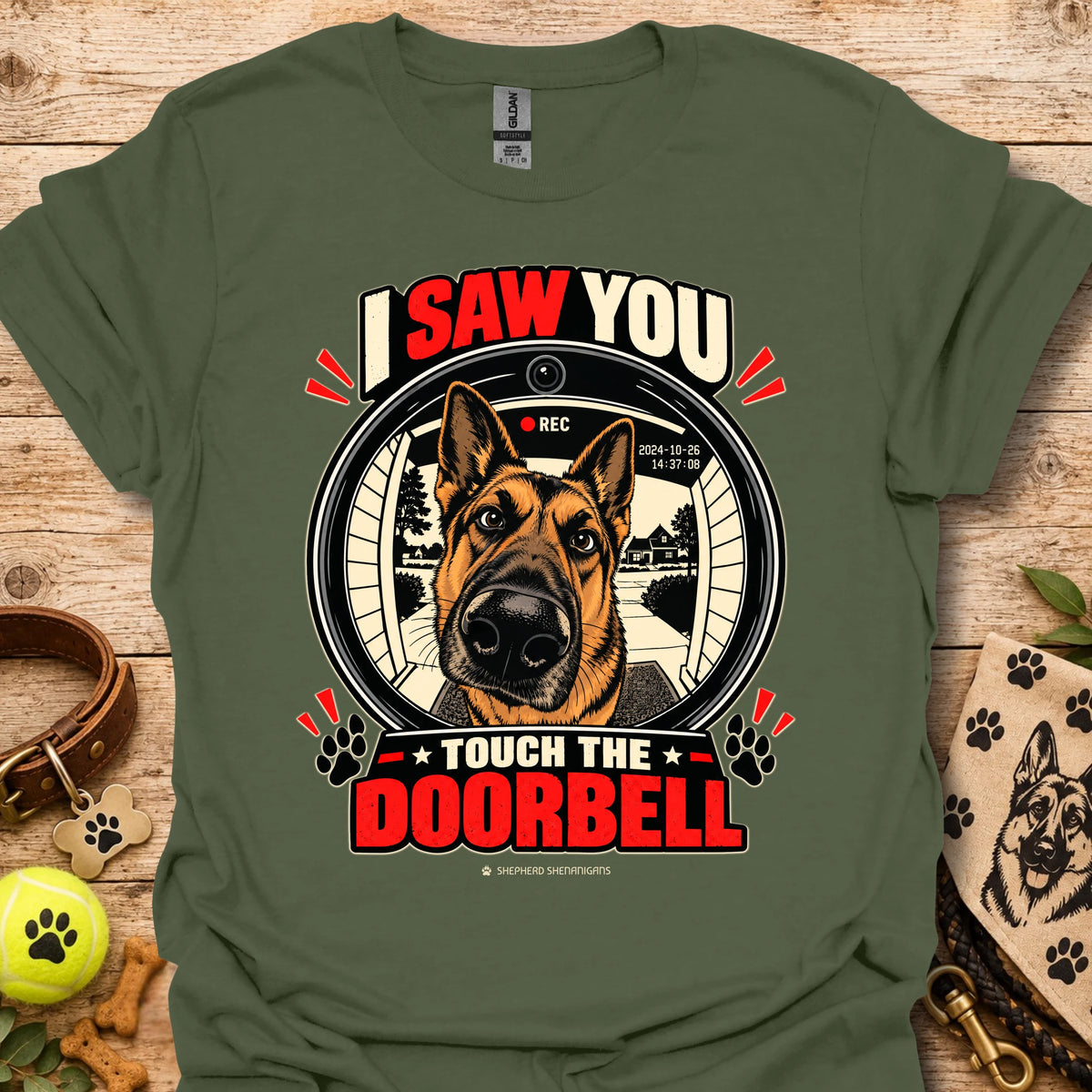 Military green dog doorbell graphic T-shirt featuring circular “Touch the Doorbell” text
