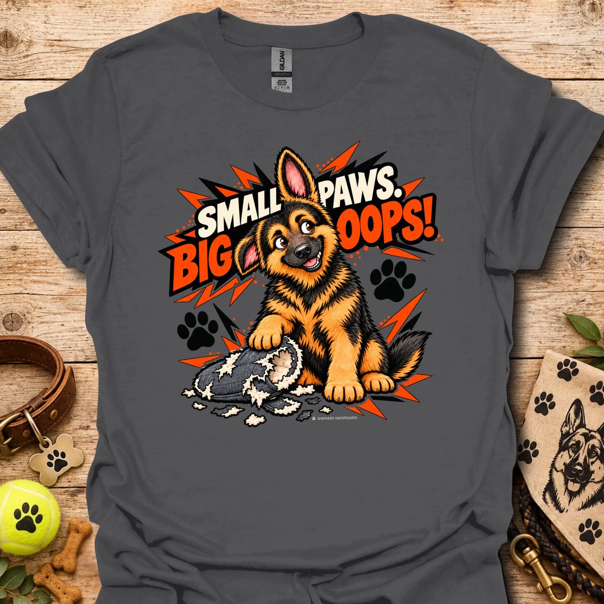 Charcoal graphic T-shirt with cartoon dog and paw print burst