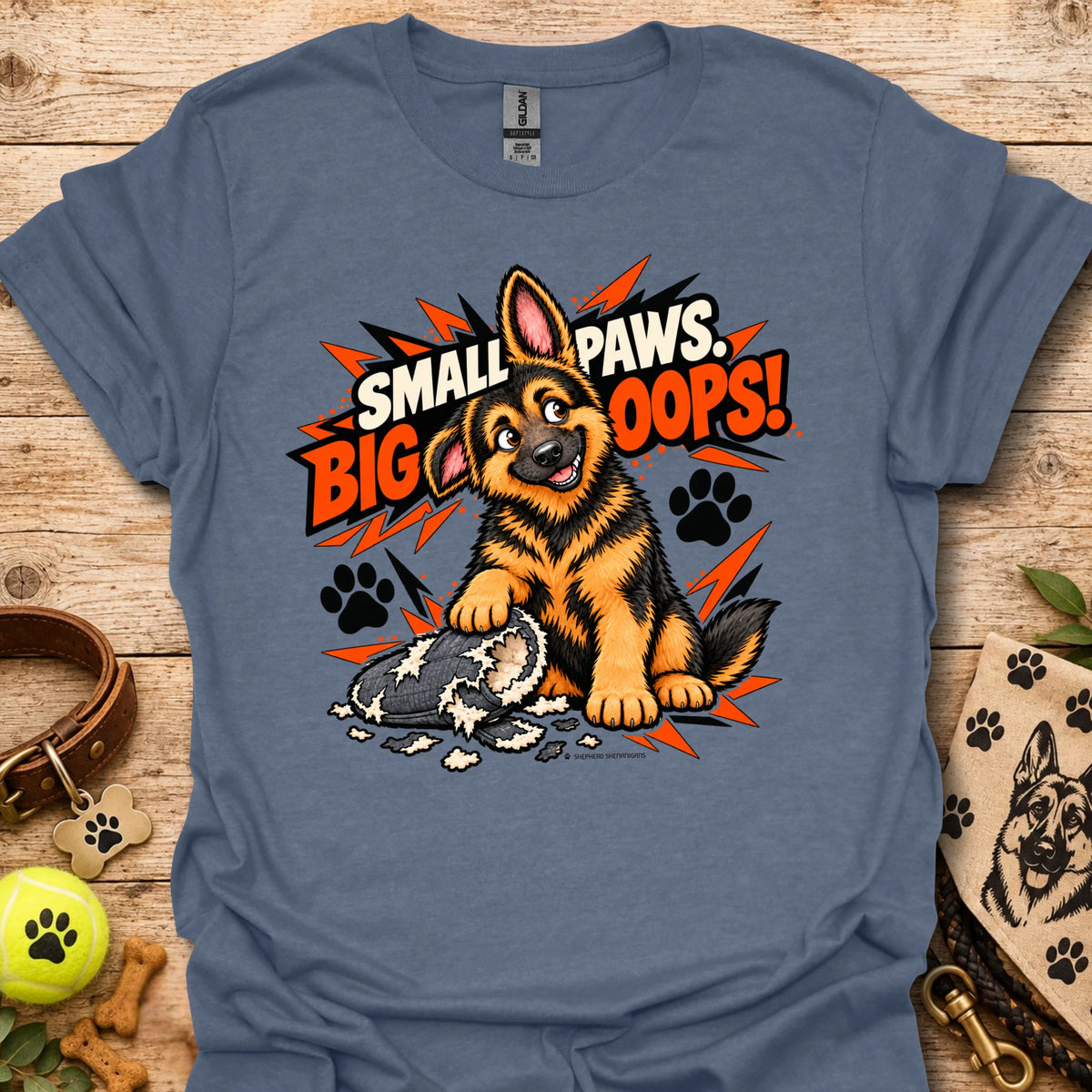 Blue graphic T-shirt with cartoon dog and paw print burst