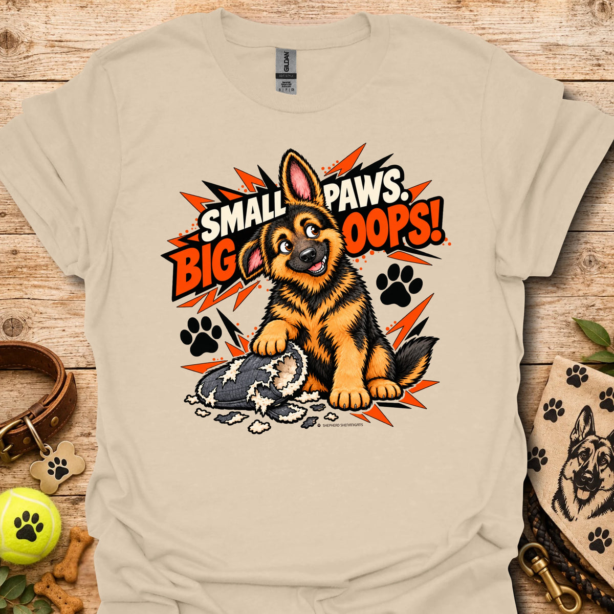 Beige graphic T-shirt with cartoon dog and paw print burst