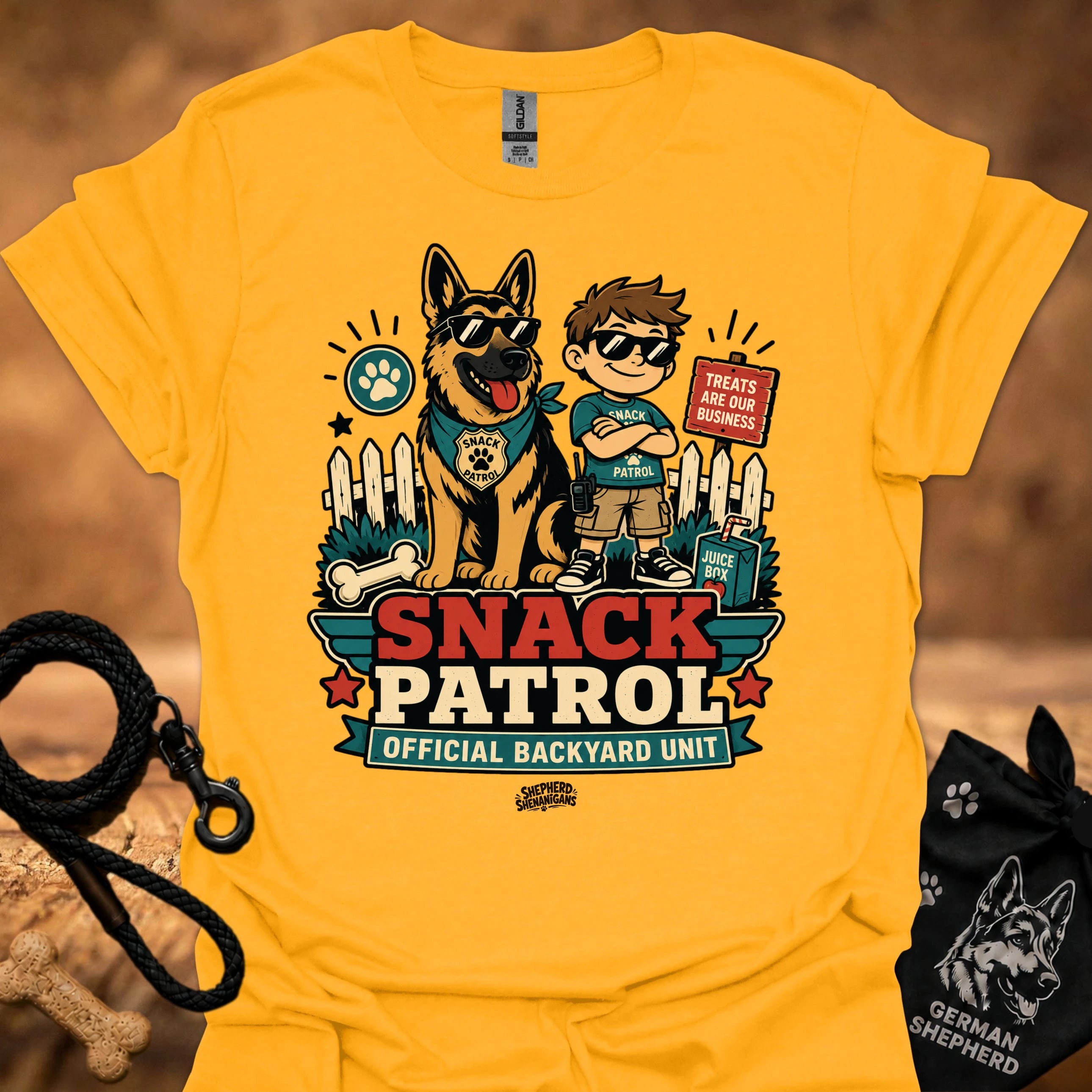 Gold graphic T-shirt with dog and boy print, Snack Patrol front text, crew neck.