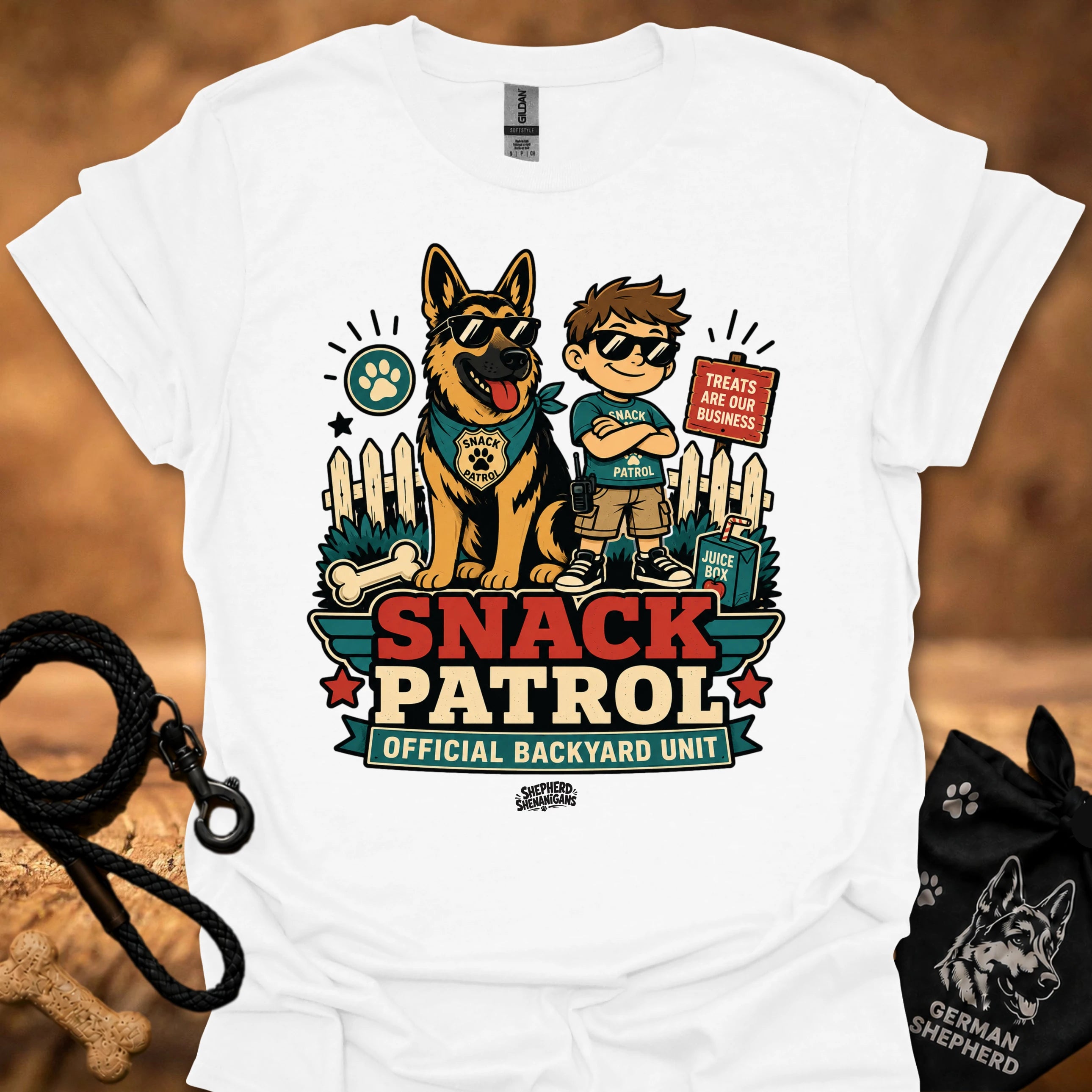 White graphic T-shirt with dog and boy print, Snack Patrol front text, crew neck.
