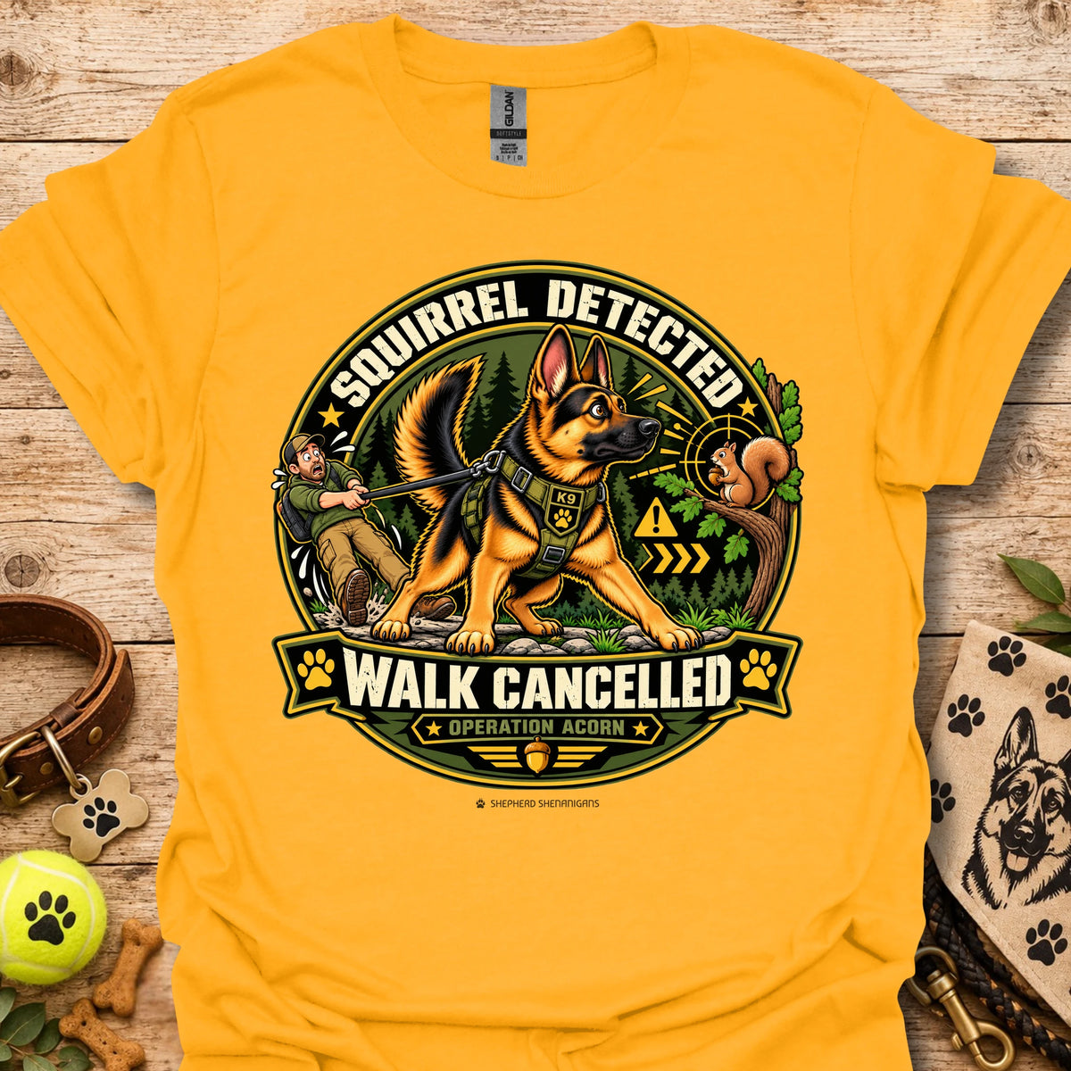 Gold/yellow crew-neck t-shirt with squirrel “Walk Cancelled” emblem graphic