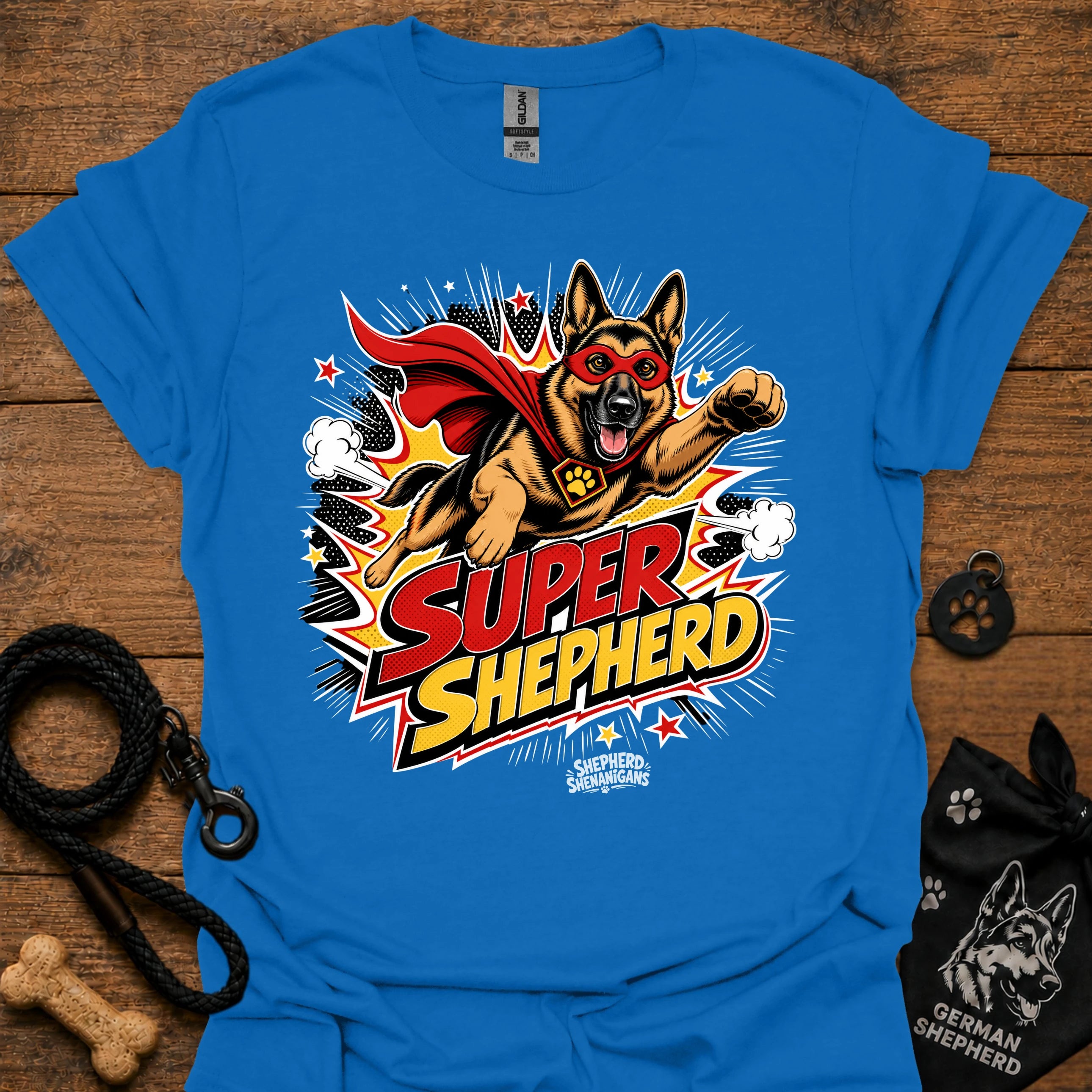 Dog graphic T-shirt in bright blue, superhero-style dog and comic logo
