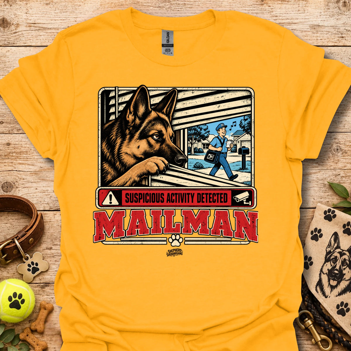 Maillman graphic T-shirt, gold with dog and 'Suspicious Activity Detected' text.