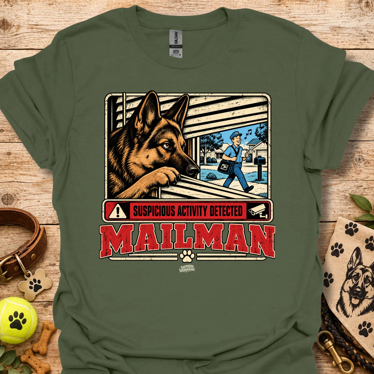 Maillman graphic T-shirt, military green with dog and 'Suspicious Activity Detected' text.