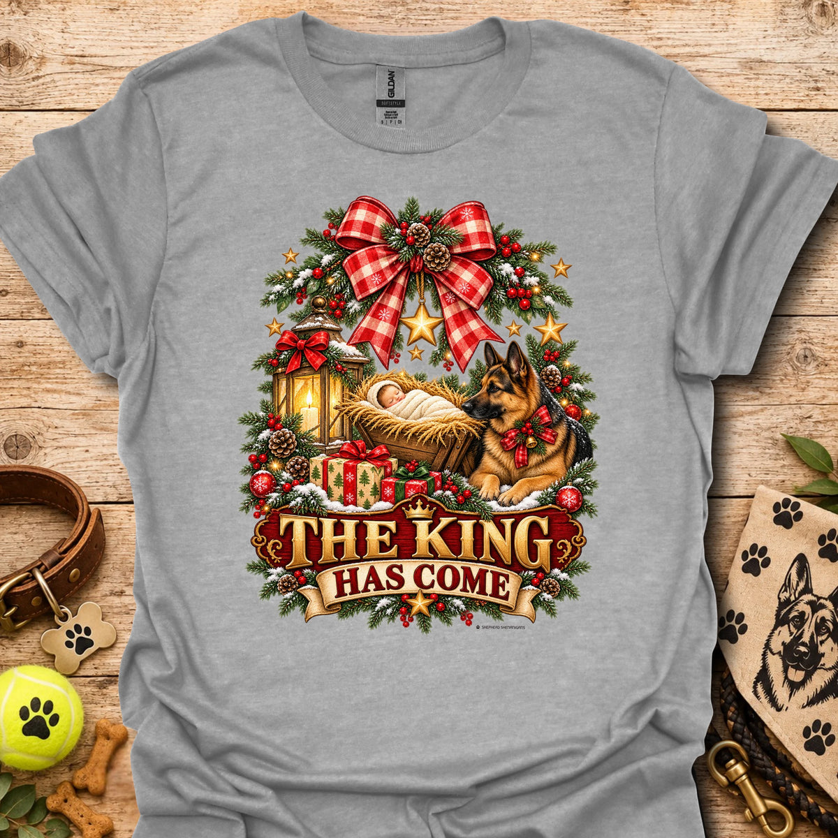 Heather gray holiday graphic T-shirt with wreath, dog, and “THE KING HAS COME” print
