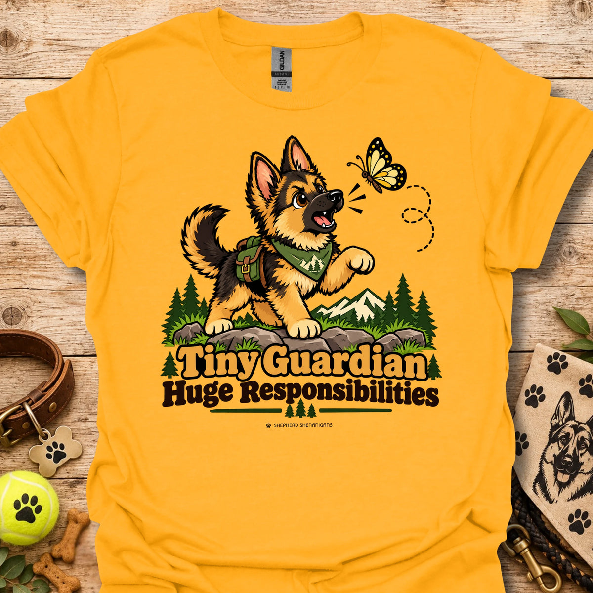 Gold kids graphic T-shirt with cartoon dog, butterfly, and "Huge Responsibilities"