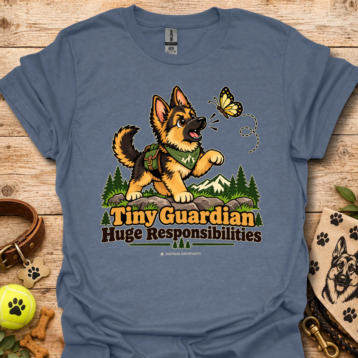 Blue kids graphic T-shirt with cartoon dog, butterfly, and "Huge Responsibilities"
