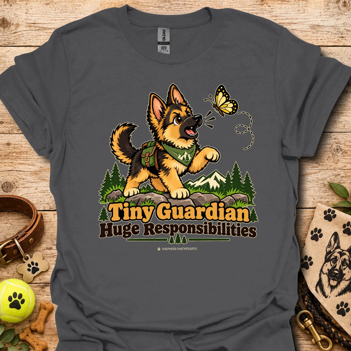 Dark gray kids graphic T-shirt with cartoon dog, butterfly, and "Huge Responsibilities"