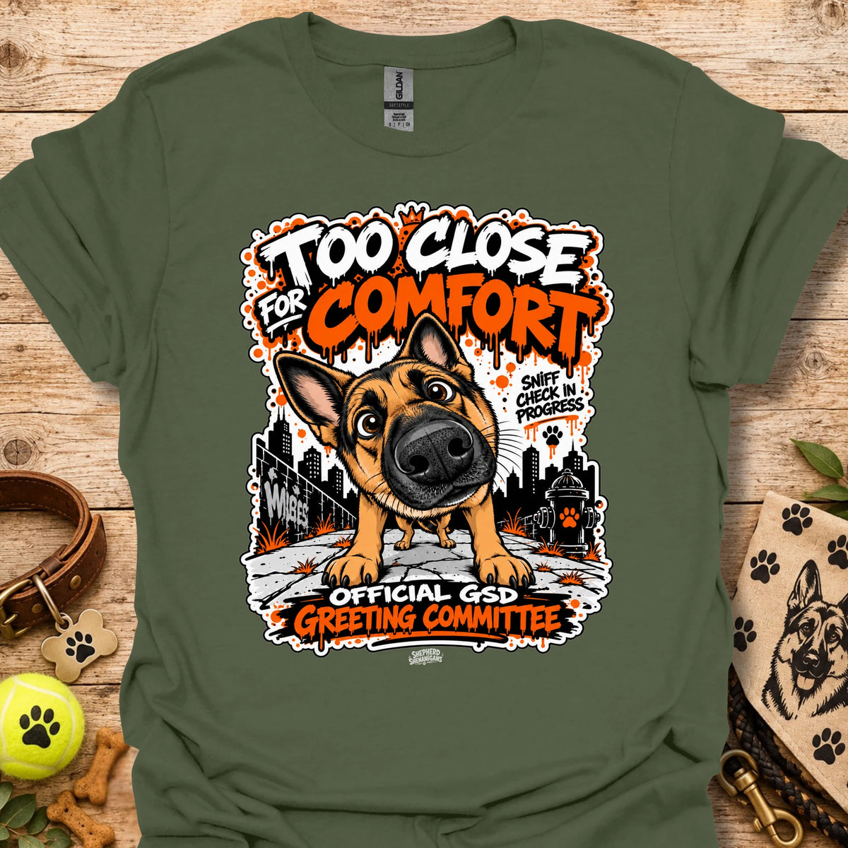 Military green dog graphic t-shirt with front print and “Too Close for Comfort” text