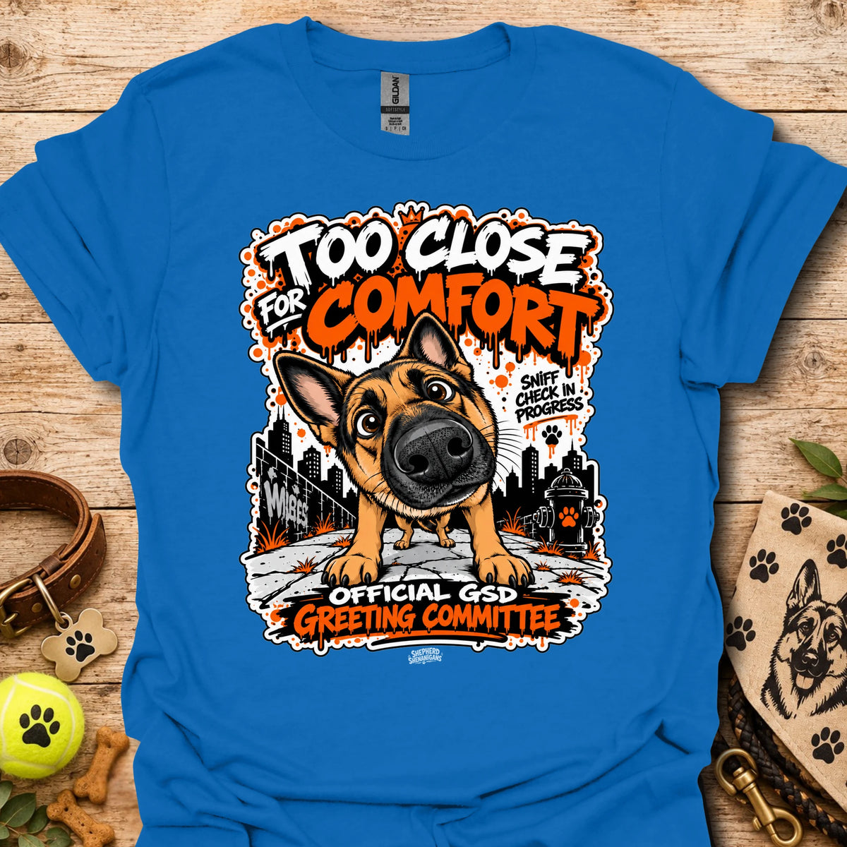 Royal blue dog graphic t-shirt with front print and “Too Close for Comfort” text