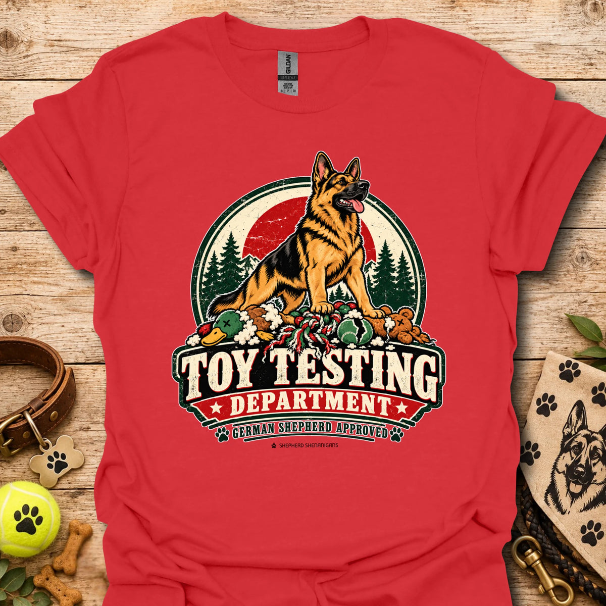 Red T-shirt with “Toy Testing Department” German shepherd graphic on chest