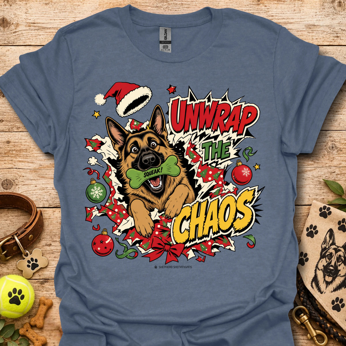 Heather indigo graphic dog t-shirt with "Unwrap the Chaos" text and Santa hat