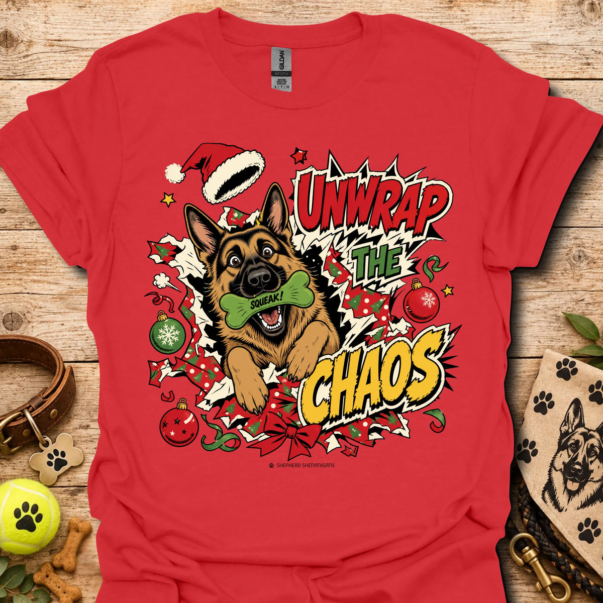 Red graphic dog t-shirt with "Unwrap the Chaos" text and Santa hat