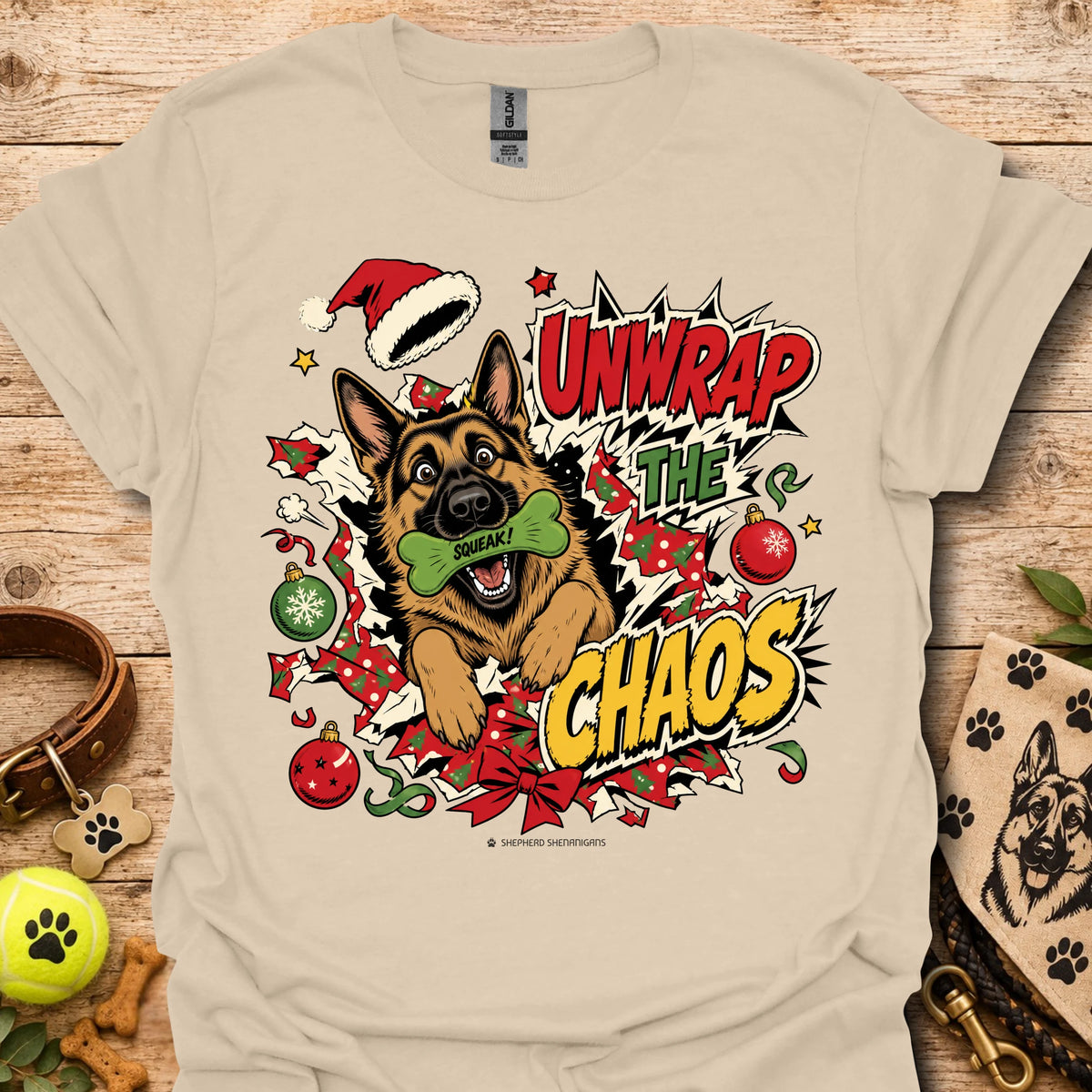 Sand graphic dog t-shirt with "Unwrap the Chaos" text and Santa hat