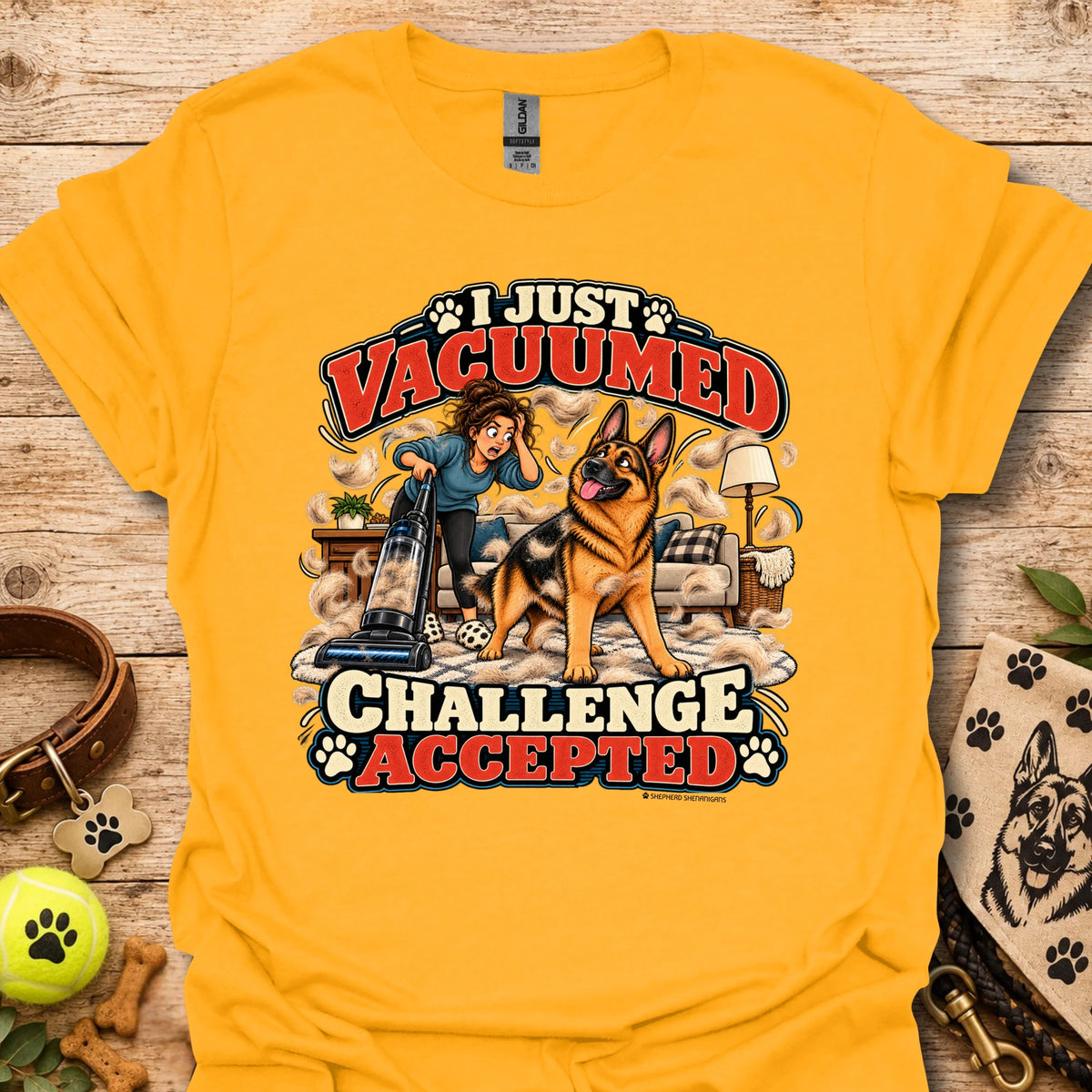 Gold crew-neck T-shirt with front graphic: “I Just Vacuumed Challenge Accepted”.