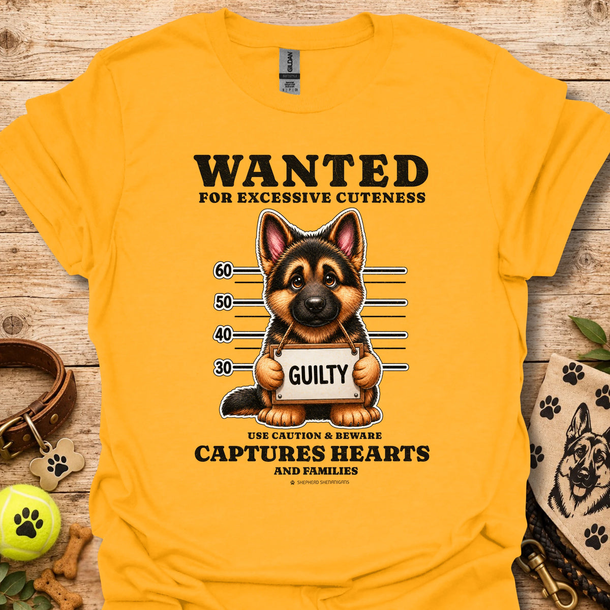 Gold T-shirt with “WANTED” dog mugshot graphic and bold text