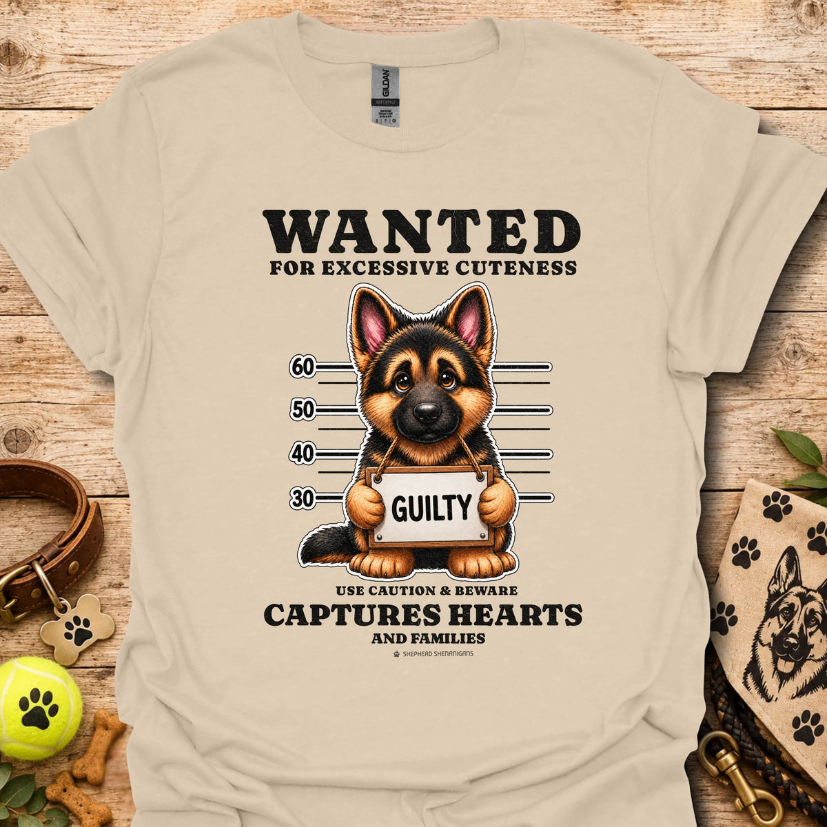 Sand T-shirt with “WANTED” dog mugshot graphic and bold text
