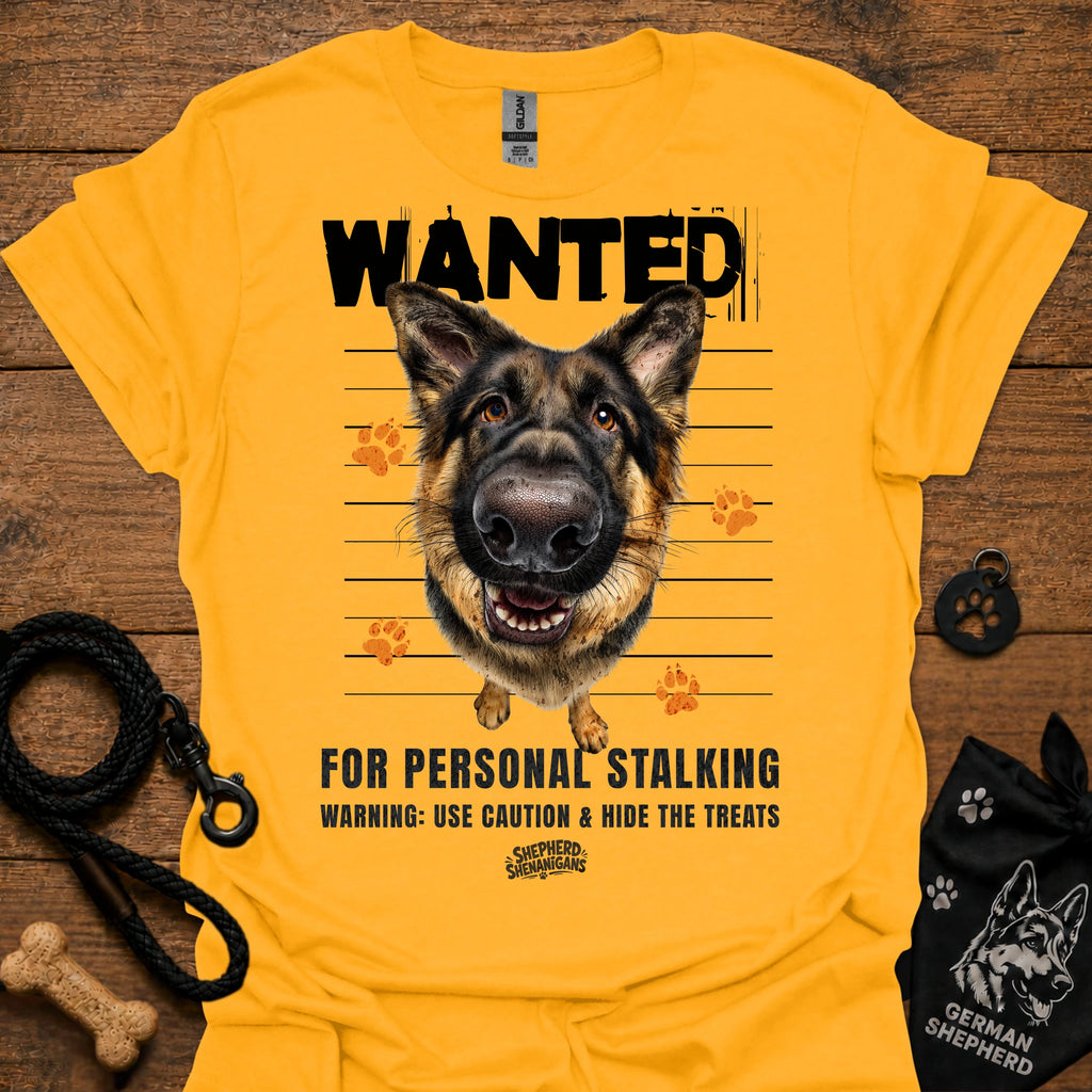 Gold T-shirt with German shepherd face and bold “WANTED” graphic with warning text