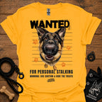 Gold T-shirt with German shepherd face and bold “WANTED” graphic with warning text