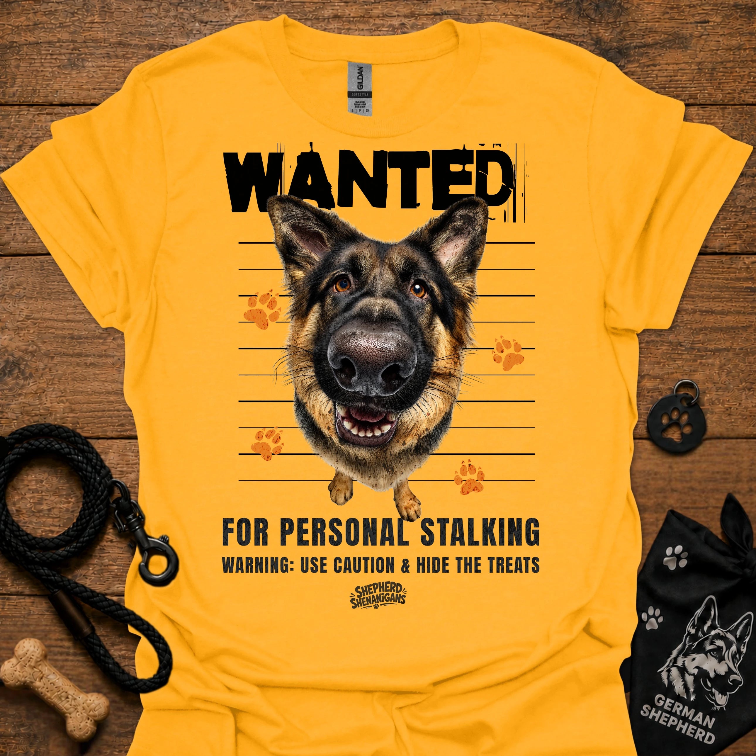 Gold T-shirt with German shepherd face and bold “WANTED” graphic with warning text