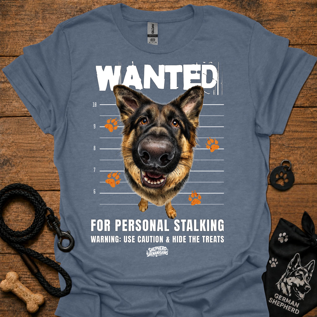 Light blue T-shirt with German shepherd face and bold “WANTED” graphic with warning text