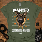 Military green T-shirt with German shepherd face and bold “WANTED” graphic with warning text