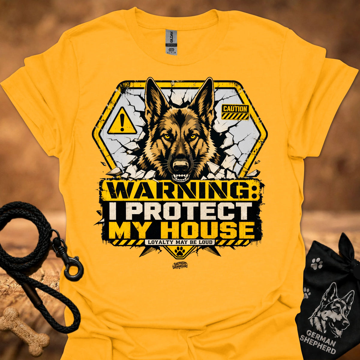 Warning dog graphic t-shirt in gold, front shows German shepherd with caution signs.