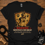 Black dog graphic T-shirt with shield, paw prints, and “Warning” text