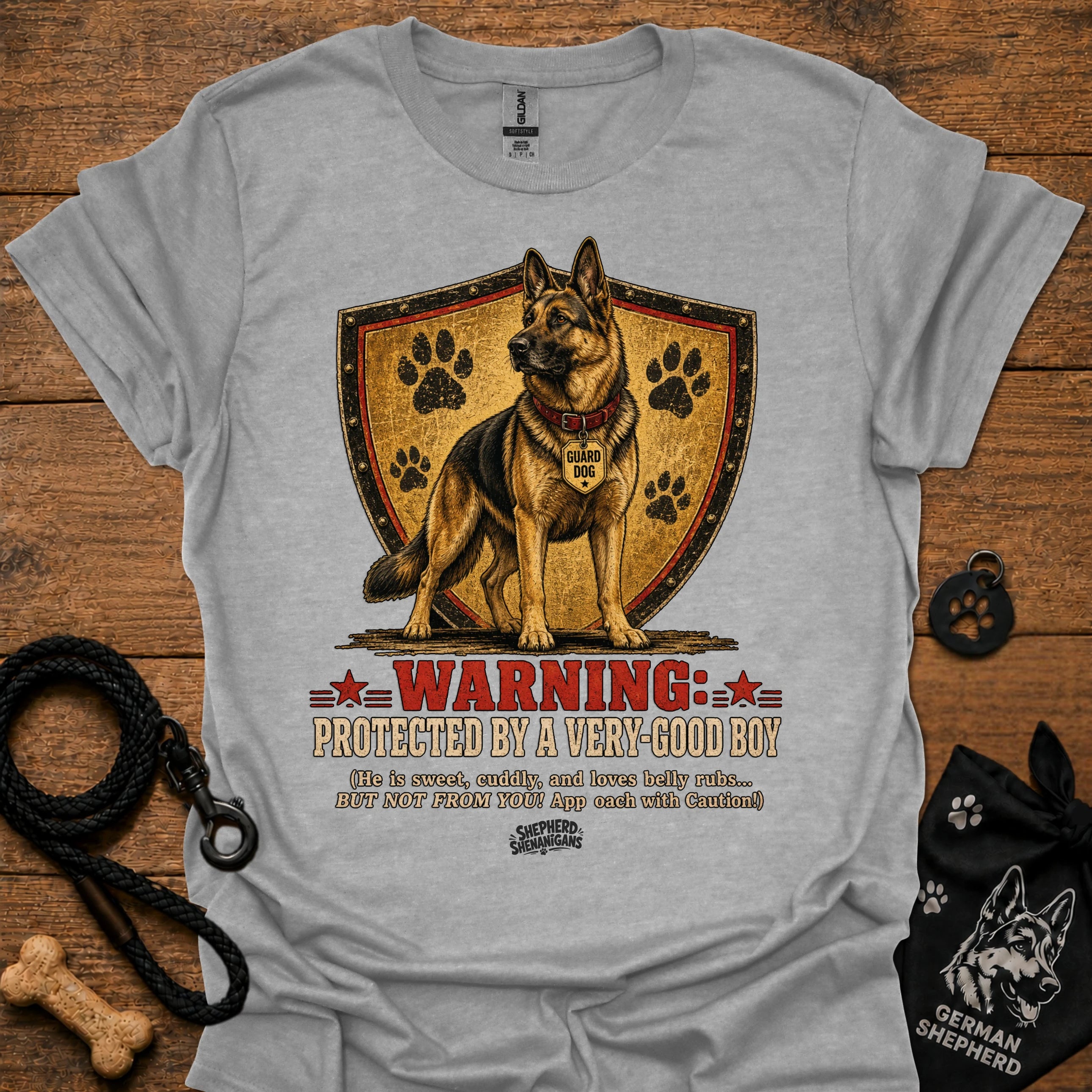Heather gray dog graphic T-shirt with shield, paw prints, and “Warning” text