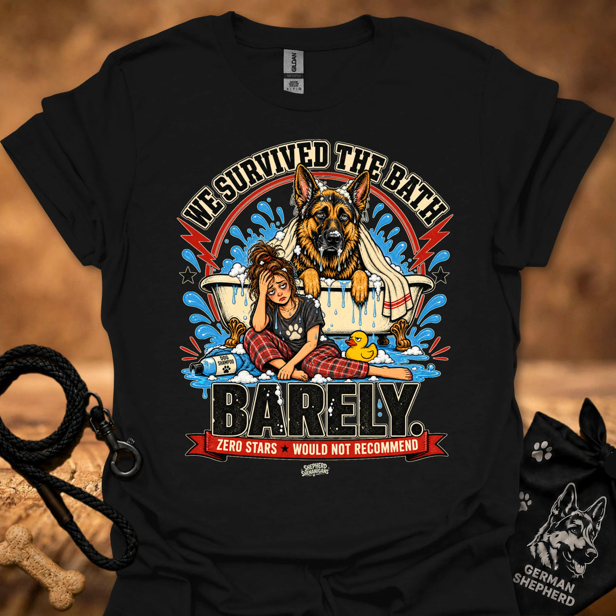 Black T-shirt with large dog-and-girl cartoon graphic, crew neck.
