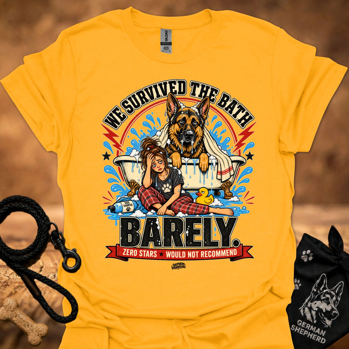 Gold T-shirt with large dog-and-girl cartoon graphic, crew neck.