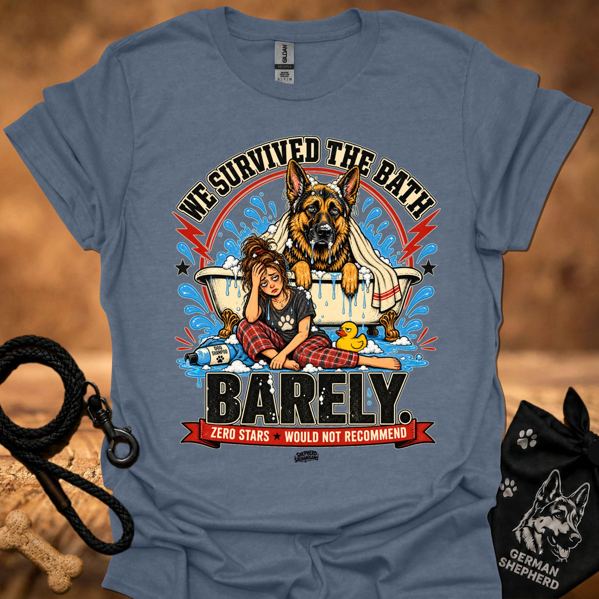 Denim blue T-shirt with large dog-and-girl cartoon graphic, crew neck.
