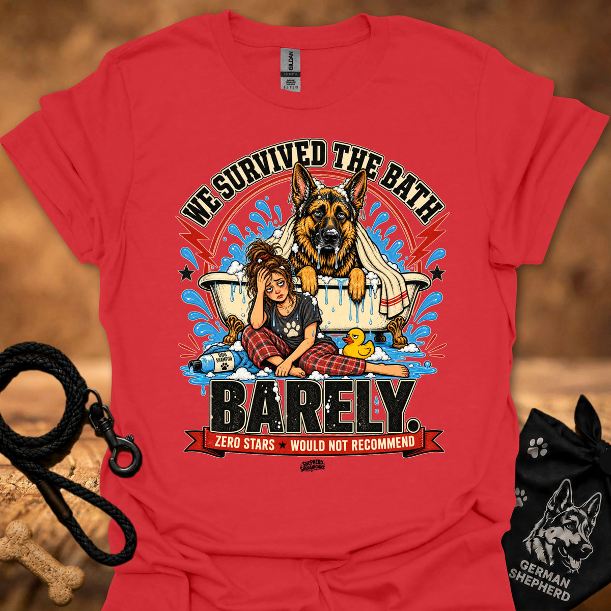 Red T-shirt with large dog-and-girl cartoon graphic, crew neck.