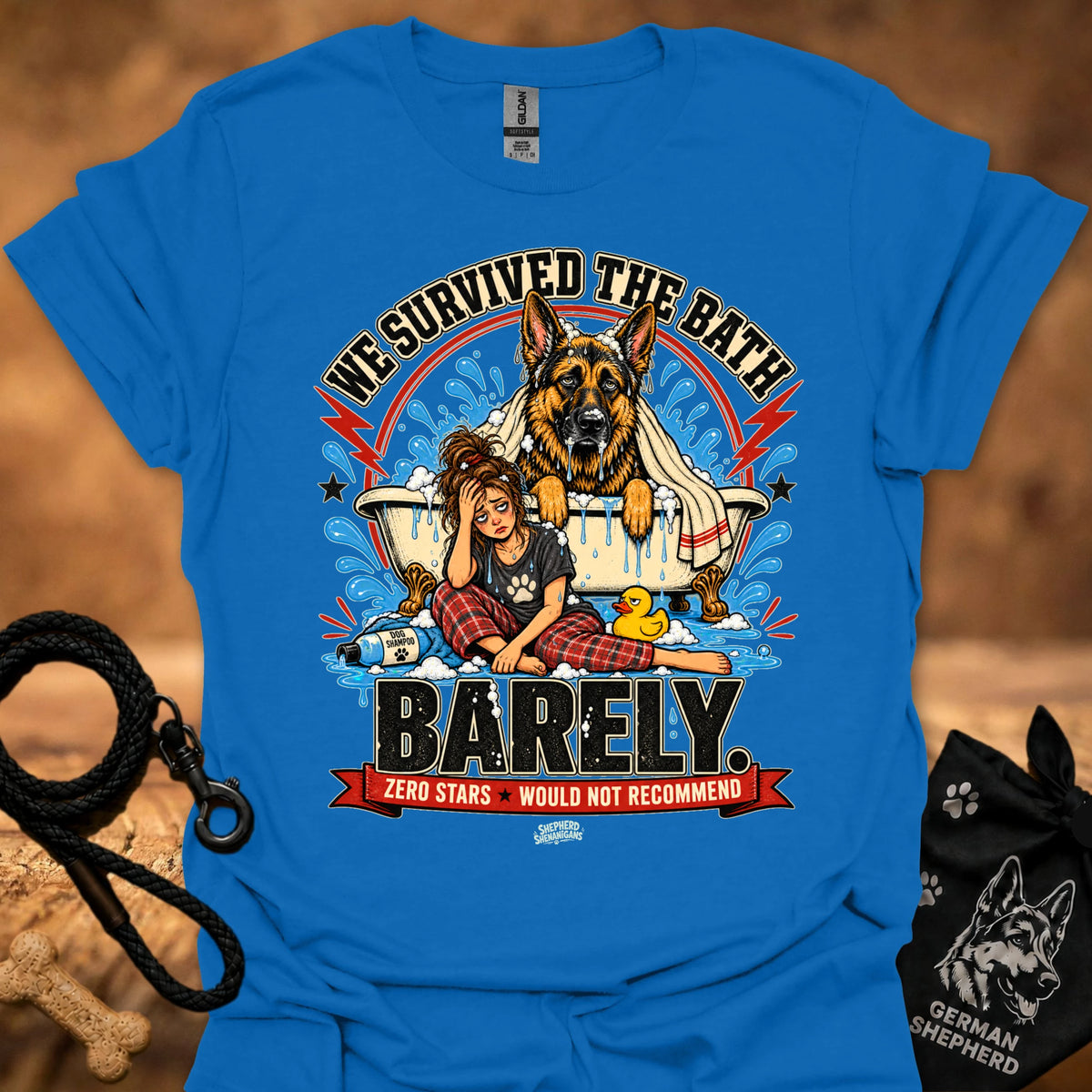 Bright blue T-shirt with large dog-and-girl cartoon graphic, crew neck.